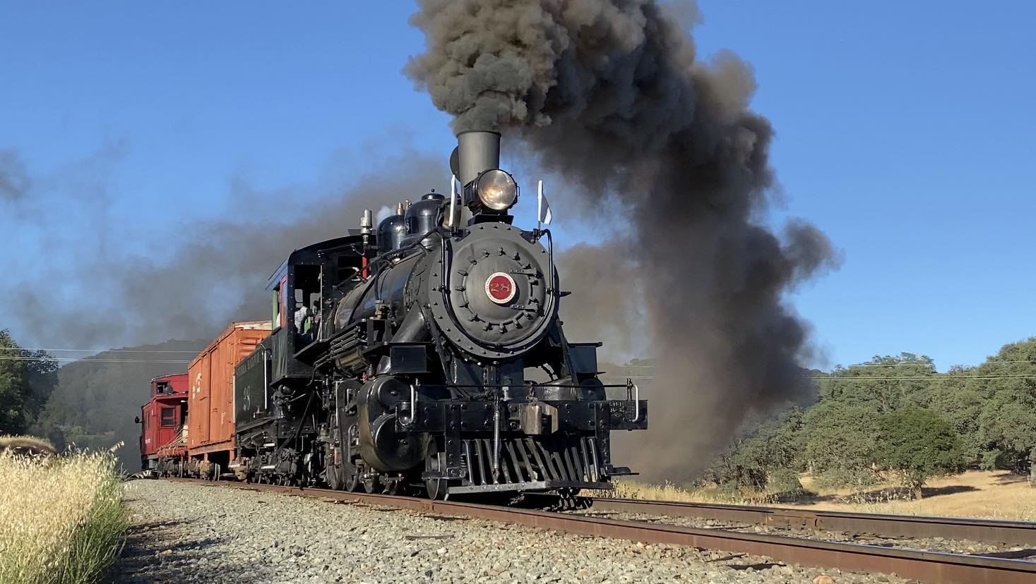 Sierra Locomotive No. 28 pulling a train with black smoke